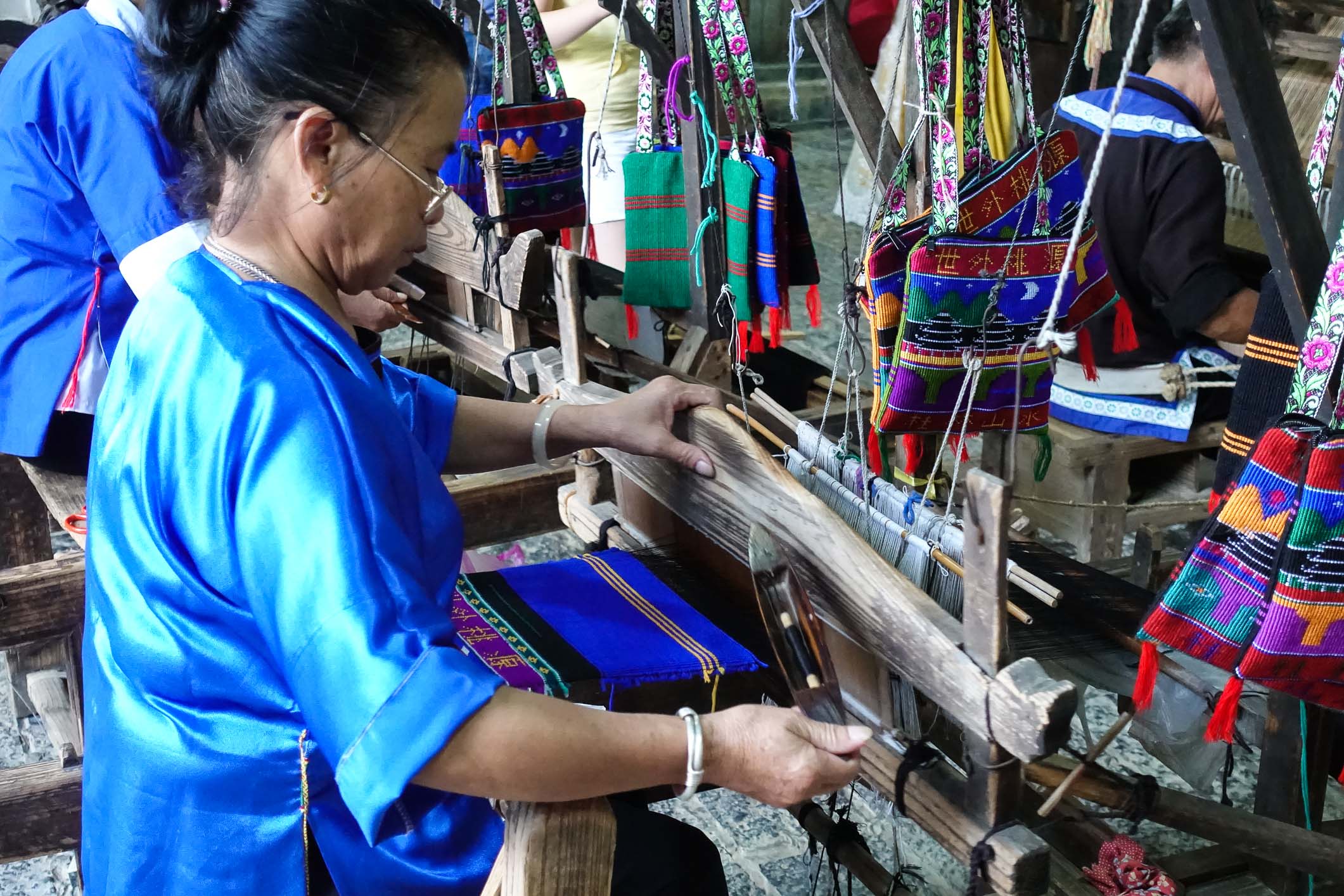 Old woman making clothes